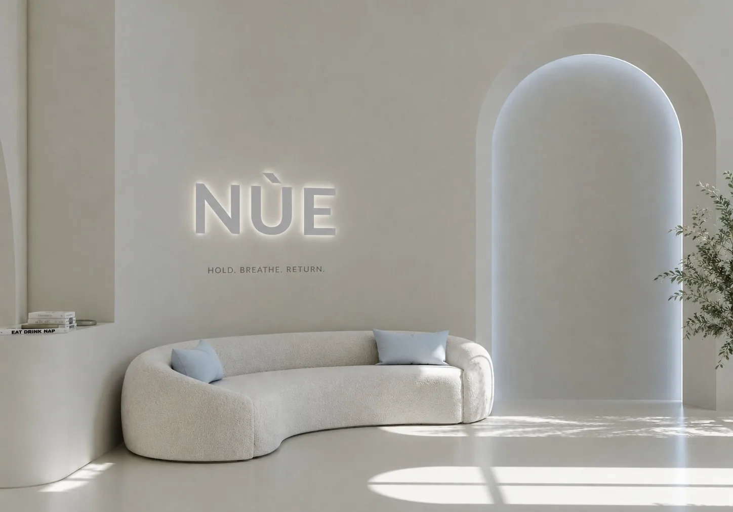 NÙE lounge with illuminated wordmark and tagline