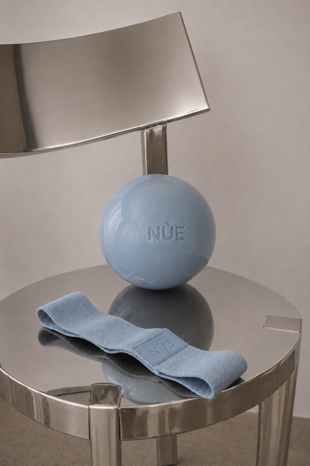 NÙE ball and resistance band on a mirrored table
