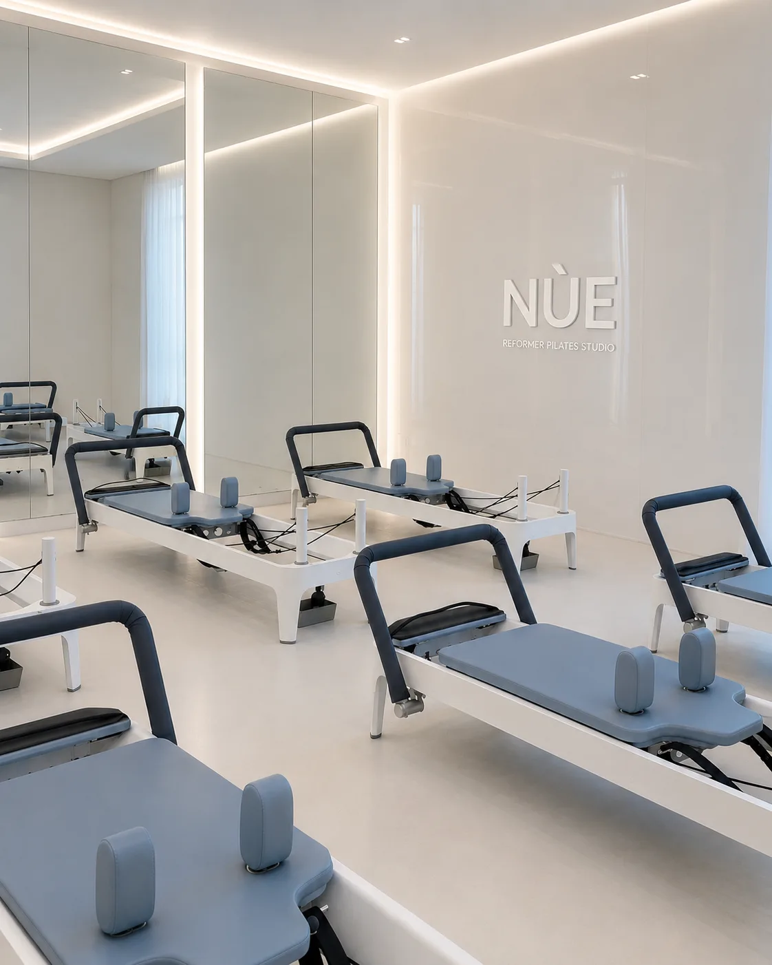 NÙE reformer room with brand mark on wall