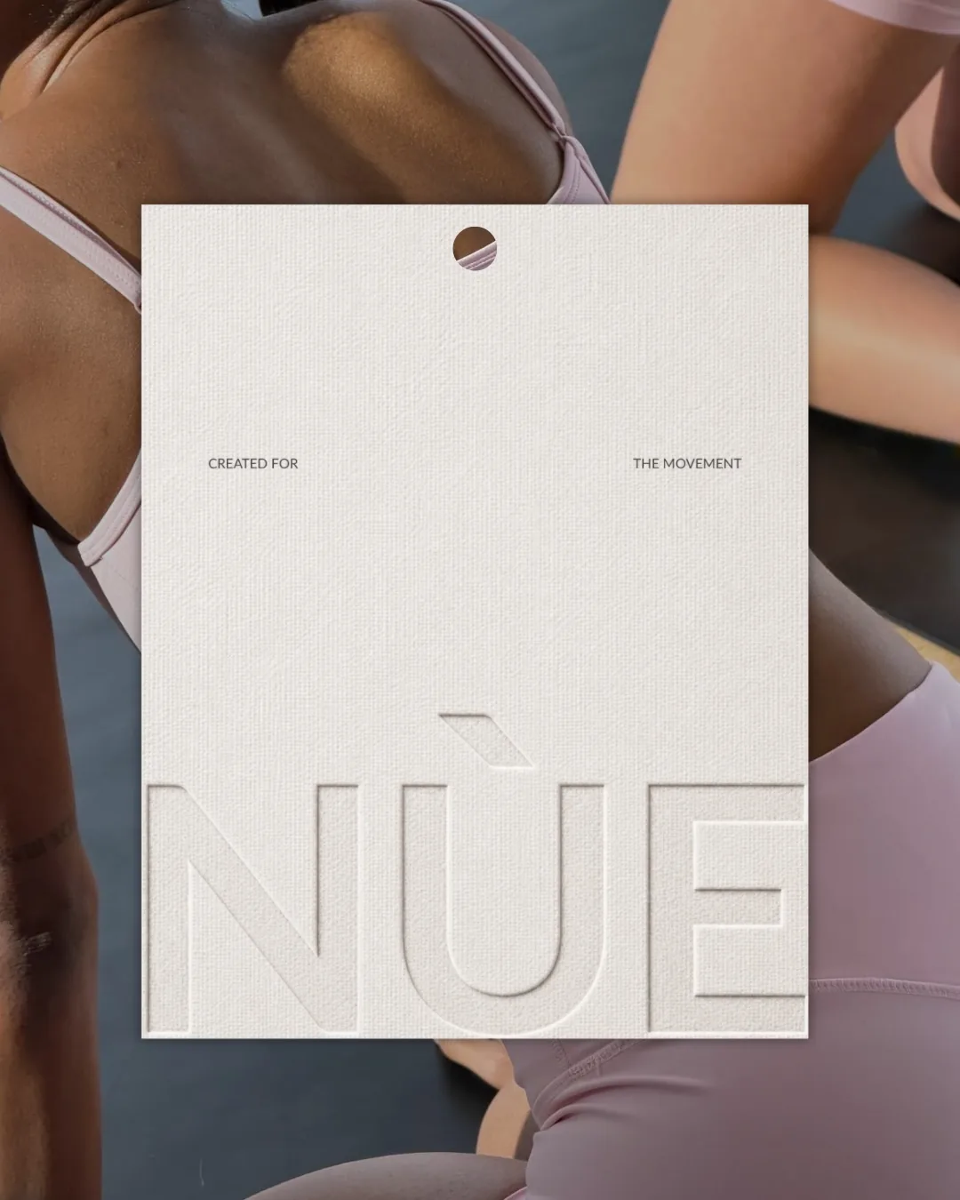 NÙE off-white primary tag with blind emboss
