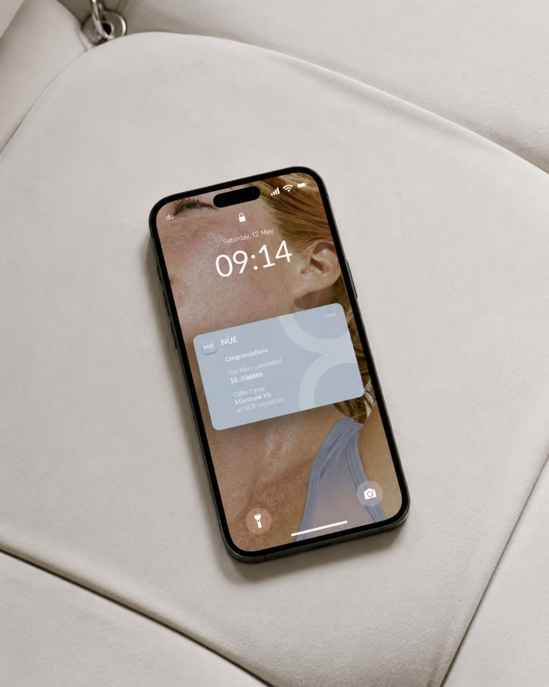 NÙE milestone rewards notification on lock screen