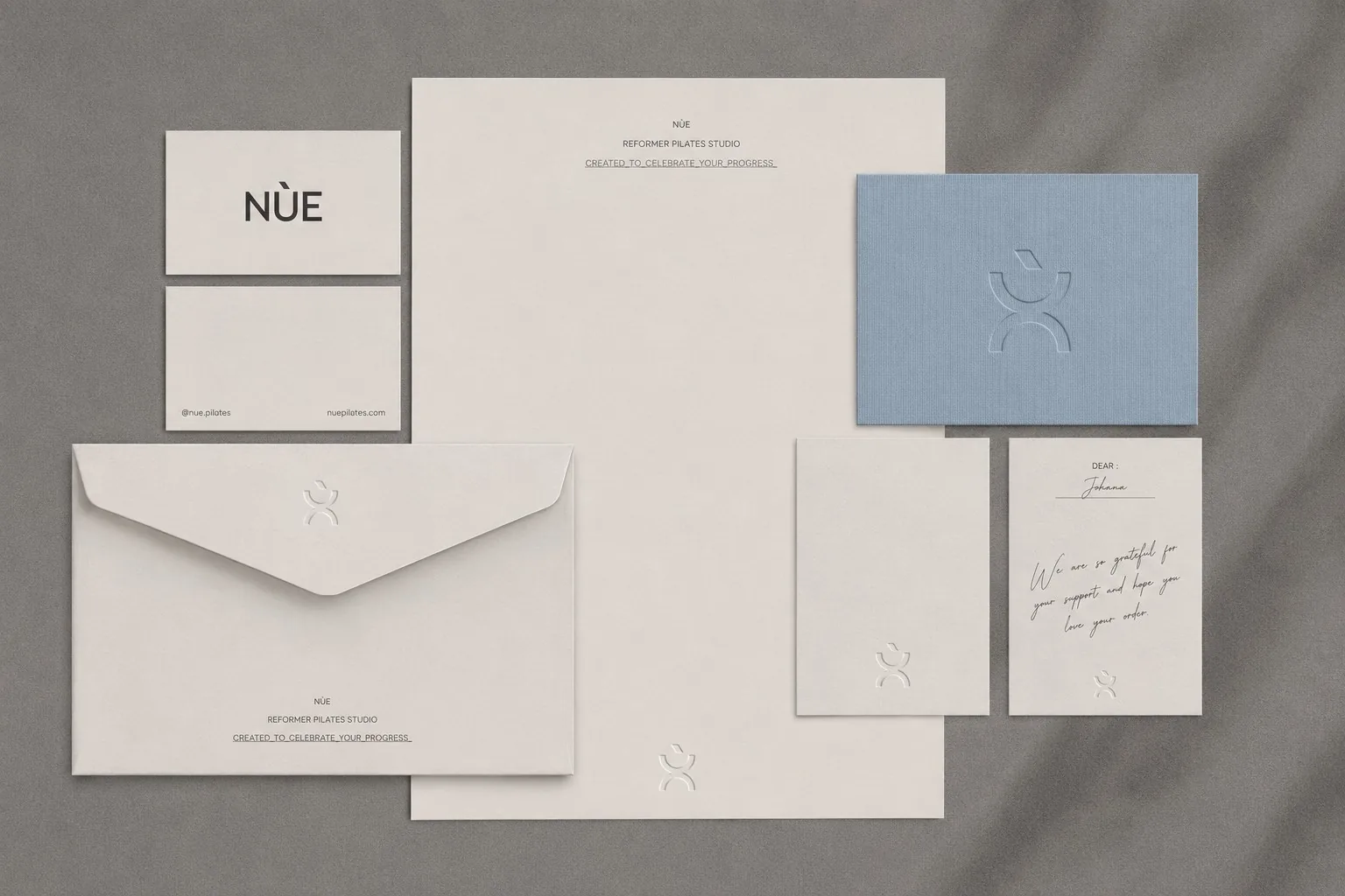 NÙE stationery suite laid flat