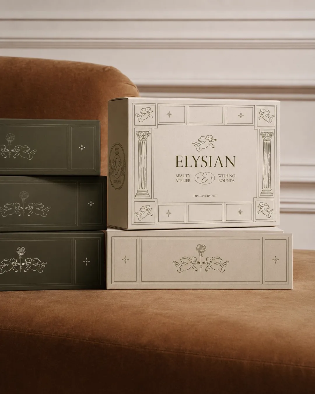 Elysian discovery set boxes stacked on velvet chair